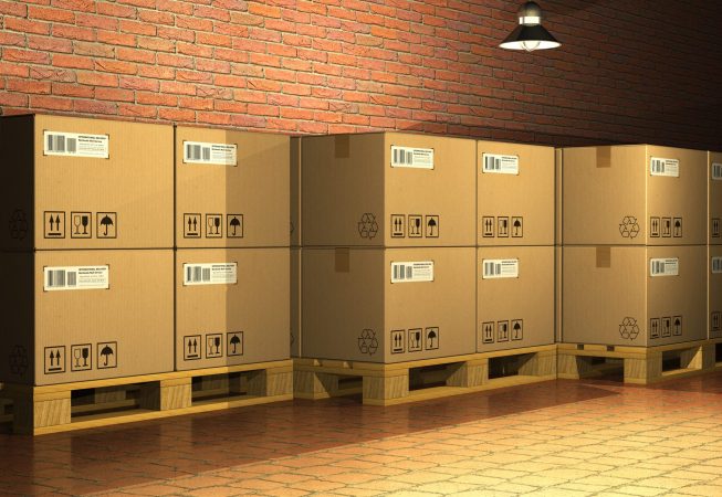 Cardboard boxes on shipping pallets in storage warehouse